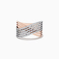 The 14K Two-Tone Gold Diamond Crossover Ring features multiple wavy bands encrusted with round diamonds, elegantly crossing over each other in a sophisticated, overlapping design.