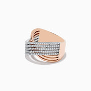 The 14K Two-Tone Gold Diamond Crossover Ring features multiple wavy bands encrusted with round diamonds, elegantly crossing over each other in a sophisticated, overlapping design.