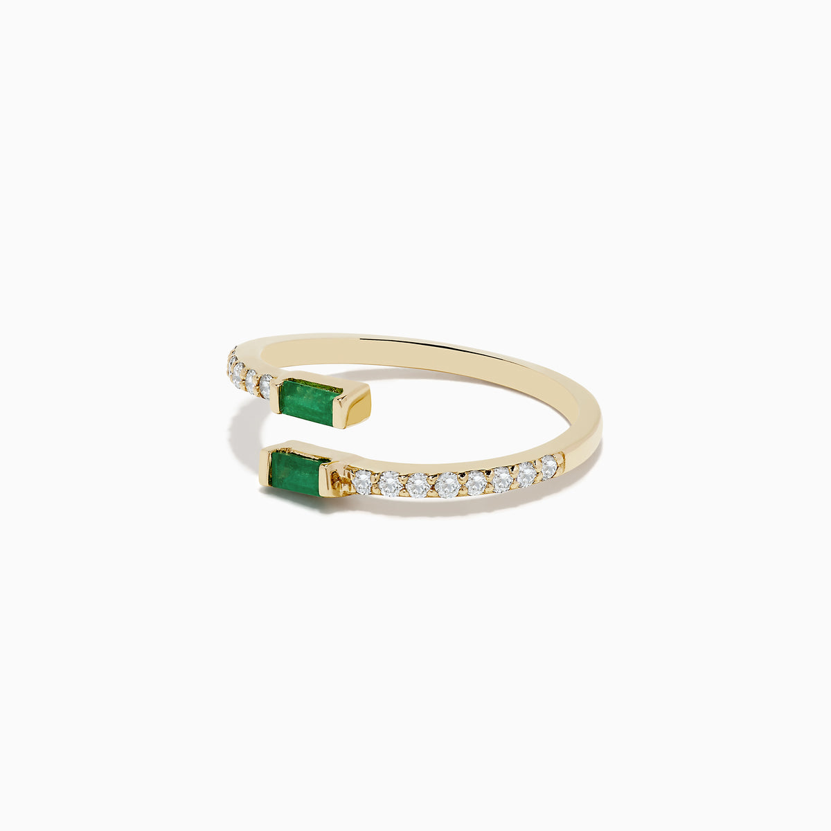The 14K Yellow Gold Emerald and Diamond Bypass Ring features two rectangular emeralds at each open end, accented by small diamonds along part of the band.