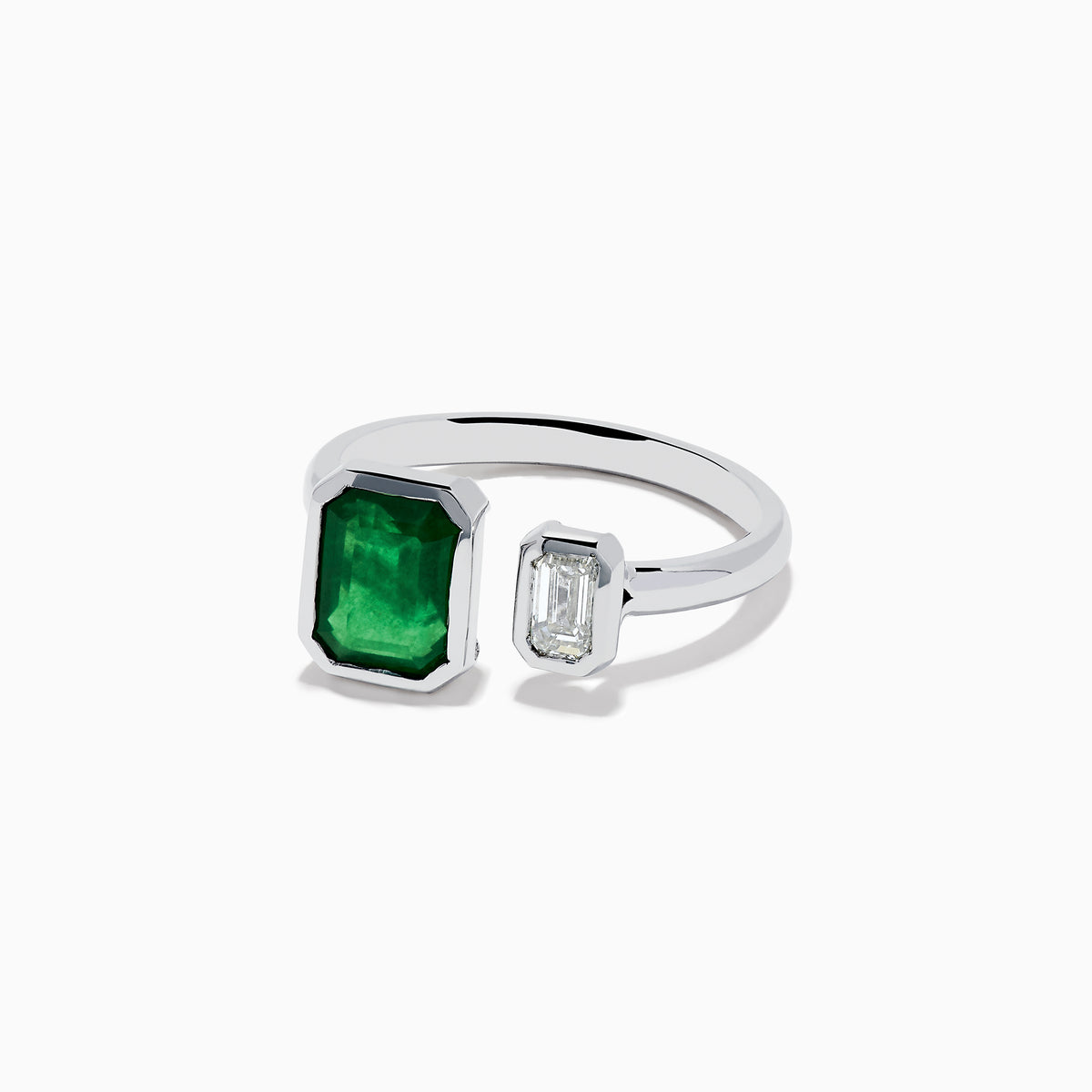 The 14K White Gold Emerald and Diamond Toi Et Moi Ring features a large rectangular green emerald and a smaller clear diamond set on a simple white gold band.