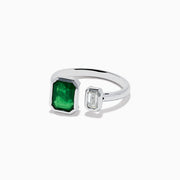 The 14K White Gold Emerald and Diamond Toi Et Moi Ring features a large rectangular green emerald and a smaller clear diamond set on a simple white gold band.