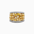 The 14K Two-Tone Gold Multi Shaped Yellow Diamond Statement Ring 4.11 TCW showcases clustered yellow diamonds at the center, bordered by white diamonds on the top and bottom, all set in a sleek two-tone gold band.