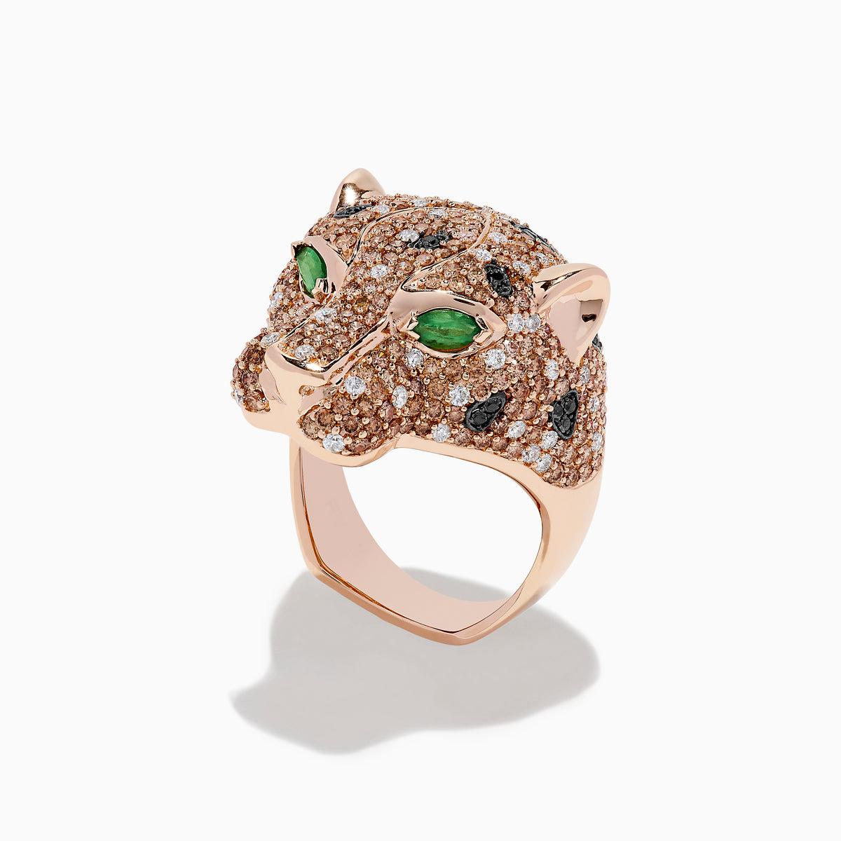 The 14K Rose Gold Emerald and Mixed Diamonds Panther Ring features a panther’s head design with brown and white diamonds, black gemstone spots, and two large emerald-green gemstones for eyes.