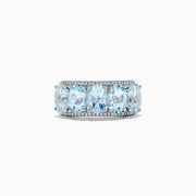 The 14k White Gold Aquamarine and Diamond ring, 3.90 TCW, showcases five oval aquamarine gems in a row with sparkling diamond accents, all set in white gold and displayed on a white background.