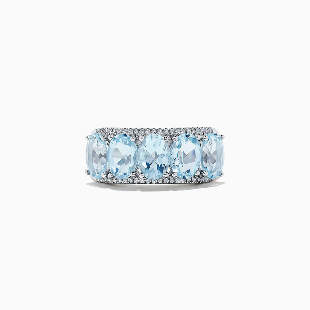 The 14k White Gold Aquamarine and Diamond ring, 3.90 TCW, showcases five oval aquamarine gems in a row with sparkling diamond accents, all set in white gold and displayed on a white background.