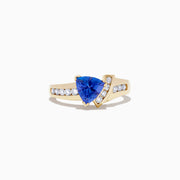 The Nahla Siri 14K Yellow Gold Tanzanite and Diamond Ring, 1.40 TCW, features a striking triangular tanzanite centerpiece accented by rows of round diamonds along both sides of the band.