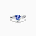 The Nahla Siri 14K White Gold Tanzanite and Diamond Ring (1.24 TCW) showcases a triangular blue tanzanite center, accented by a curved row of sparkling diamonds along the band.