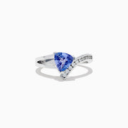 The Nahla Siri 14K White Gold Tanzanite and Diamond Ring (1.24 TCW) showcases a triangular blue tanzanite center, accented by a curved row of sparkling diamonds along the band.