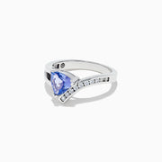 The Nahla Siri 14K White Gold Tanzanite and Diamond Ring, 1.24 TCW, features a triangular blue tanzanite gemstone and a diagonal row of small white diamonds along the band.