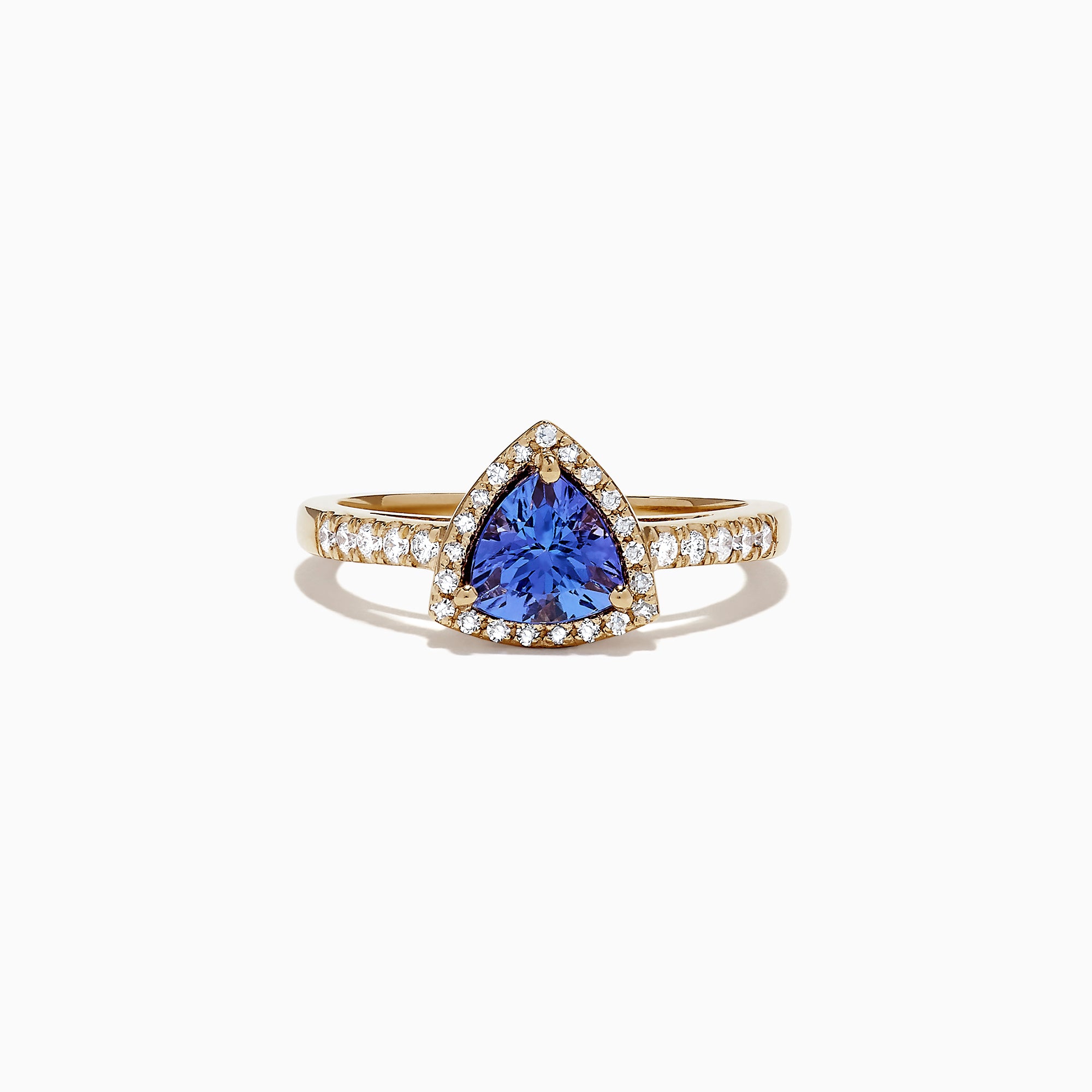 The Nahla Siri 14K Yellow Gold Tanzanite and Diamond Ring, 0.96 TCW, showcases a striking triangular tanzanite center framed by a halo of diamonds, with additional diamonds accenting the band for extra brilliance.