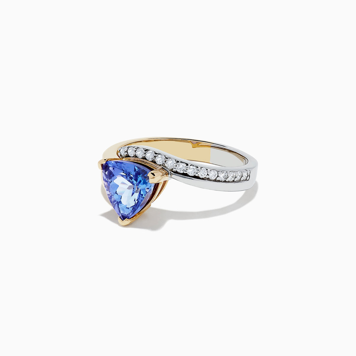 The Nahla Siri 14K 2-Tone Gold Tanzanite and Diamond Ring, 1.66 TCW, showcases a triangular-cut tanzanite center accented by a curved row of round diamonds on a plain white background.