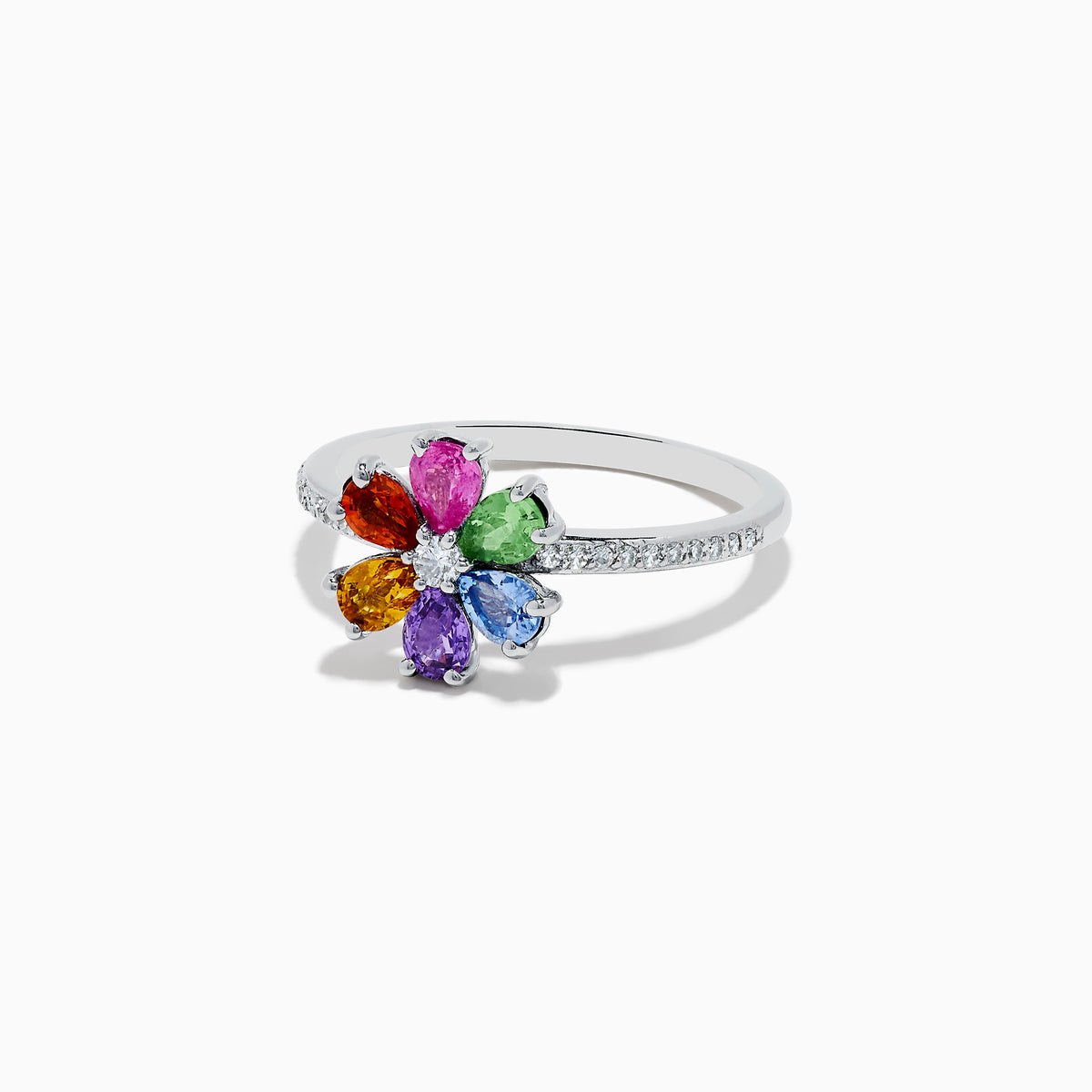 The Watercolors 14K White Gold Diamond and Multi Sapphire Flower Ring by Effy features a silver flower-shaped cluster of colorful sapphires around a central diamond, with additional diamonds set along the band for extra sparkle.
