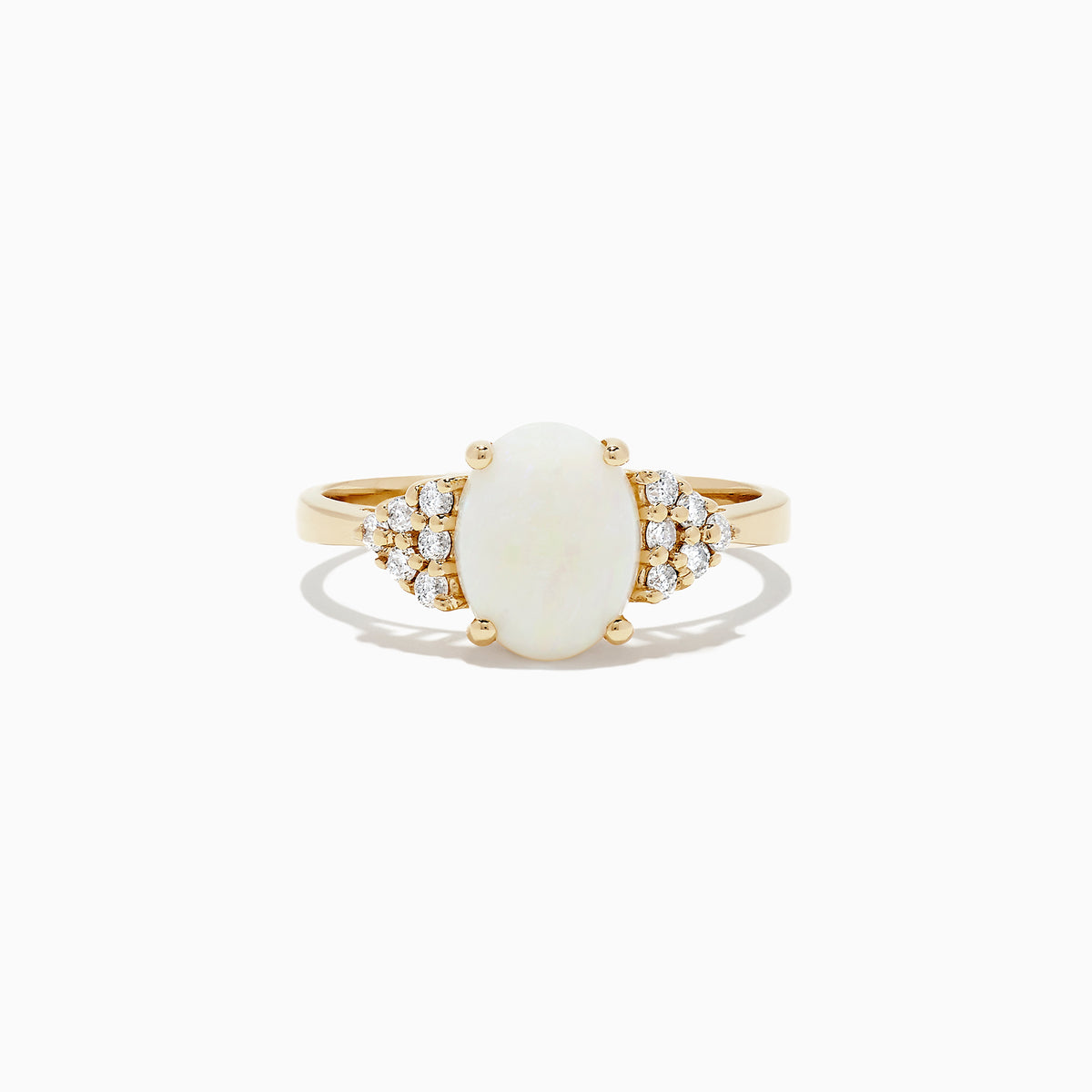 The 14K Yellow Gold Opal and Diamond Ring, 1.13 TCW features an oval white opal center accented by clusters of round diamonds on each side, all set in yellow gold against a white background.