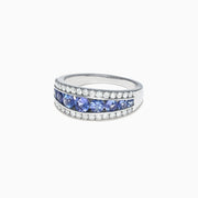The Nahla Siri 14K White Gold Tanzanite and Diamond Ring, 1.54 TCW, features a central row of round blue tanzanites accented by two rows of sparkling diamonds on each side.