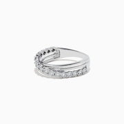 The 925 Sterling Silver Diamond Crossover Ring, 0.23 TCW, features one twisted diamond-encrusted band intertwined with a polished silver band, set against a plain white background.