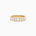 The DOro 14K Yellow Gold Channel Set Diamond Band, 0.98 TCW, showcases round-cut diamonds set in a sleek channel design and is elegantly presented on a plain white background.