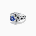 The Signature 14K White Gold Tanzanite and Diamond Panther Ring, 2.07 TCW, features black spots, green eyes, and a blue heart-shaped tanzanite gemstone held in the panther’s mouth.