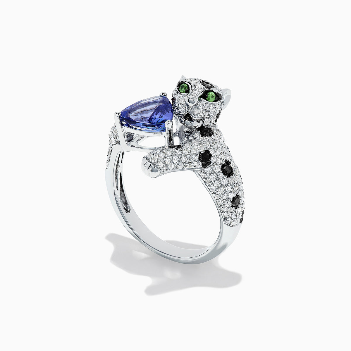 The Signature 14K White Gold Tanzanite and Diamond Panther Ring, 2.07 TCW, features black spots, green eyes, and a blue heart-shaped tanzanite gemstone held in the panther’s mouth.