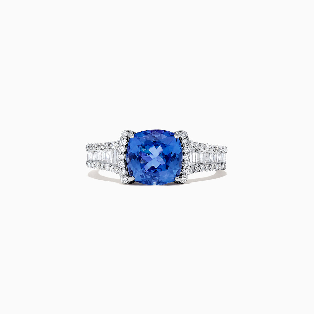 The Nahla Siri 14K White Gold Tanzanite and Diamond Ring, 2.18 TCW, features a cushion-cut blue tanzanite center accented by rows of sparkling diamonds on the band, shown against a white background.