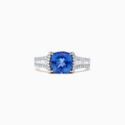 The Nahla Siri 14K White Gold Tanzanite and Diamond Ring, 2.18 TCW, features a cushion-cut blue tanzanite center accented by rows of sparkling diamonds on the band, shown against a white background.