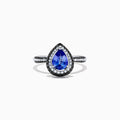 The Nahla Siri 14K White Gold Tanzanite and Diamond Ring, 1.43 TCW, features a pear-shaped blue tanzanite with a halo of white diamonds and diamond accents on the band, displayed on a white background.