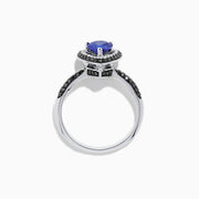The Nahla Siri 14K White Gold Tanzanite and Diamond Ring, 1.43 TCW, features a pear-shaped blue tanzanite with a halo of white diamonds and diamond accents on the band, displayed on a white background.
