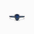 The Signature 14K White Gold Sapphire and Diamond Panther Ring, 0.59 TCW, features a panther head adorned with sapphire-blue accents and green gemstone eyes, shown against a white background.