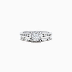 A beautiful Bridal 14K White Gold Diamond Cluster Ring and Band Set, 0.72 TCW, featuring a round central diamond, surrounded by smaller diamonds on a split shank for extra sparkle.