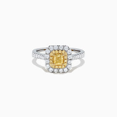 The Canare 18K Two Tone Gold Cushion Double Halo Yellow Diamond Ring, 0.97 TCW, features a square yellow diamond center with double white diamond halos and additional diamonds on the band.