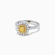 The Canare 18K Two Tone Gold Cushion Double Halo Yellow Diamond Ring, 0.97 TCW, features a square yellow diamond center with double white diamond halos and additional diamonds on the band.