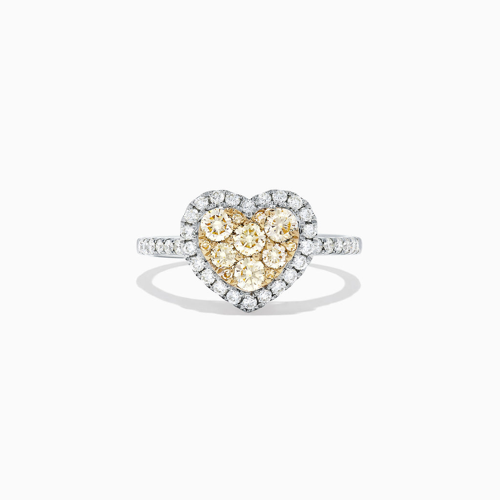 The Canare 14K Two Tone Gold Heart Shaped Yellow Diamond Heart Ring (0.77 TCW) features clustered yellow diamonds at the center, a halo of white diamonds, and a diamond-encrusted two tone gold band, shown on a white background.
