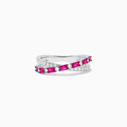 The Ruby Royale 14K White Gold Ruby and Diamond Crossover Band features a wavy, intertwined design with alternating square-cut rubies and round diamonds.