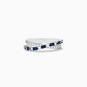 The Royale Bleu 14K White Gold Blue Sapphire and Diamond Crossover Ring features a wavy, crisscross design with alternating blue sapphires and round white diamonds on the bands, displayed on a plain white background.