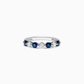 The Royale Bleu 14K White Gold Blue Sapphire and Diamond Ring (0.96 TCW) showcases alternating round blue sapphires and white diamonds set in a row along the band, displayed on a white background.