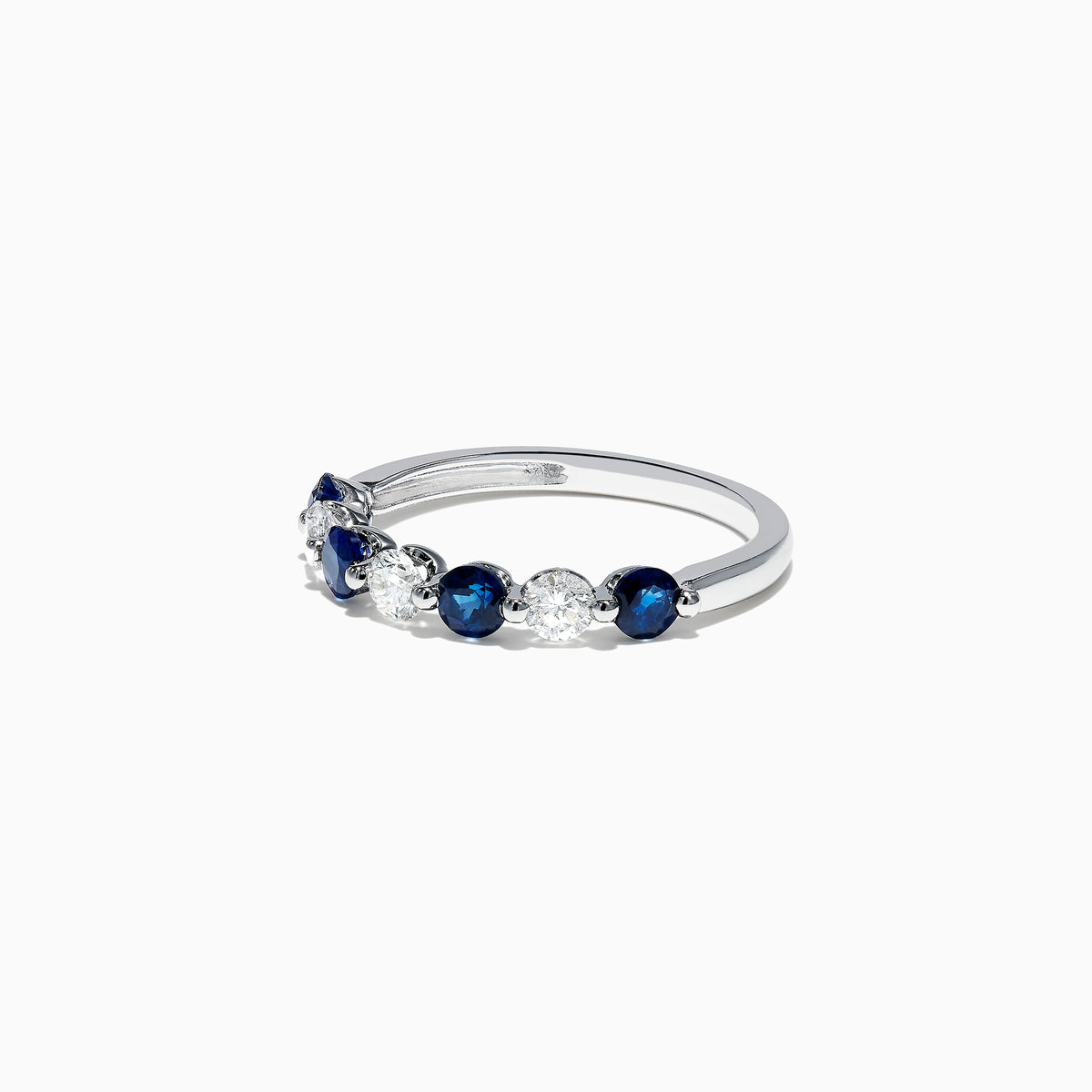 The Royale Bleu 14K White Gold Blue Sapphire and Diamond Ring (0.96 TCW) showcases alternating round blue sapphires and white diamonds set in a row along the band, displayed on a white background.