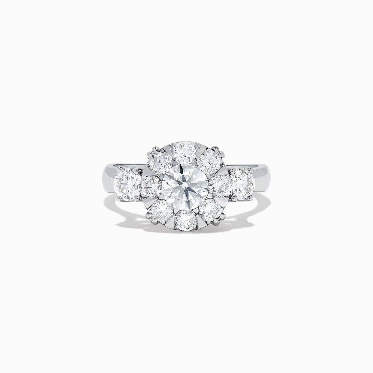 The Bouquet 14K White Gold Diamond Engagement Ring features a large round center diamond, a halo of sparkling stones, and diamonds along the band for added brilliance. Shown on a white background. Total carat weight: 1.91 TCW.