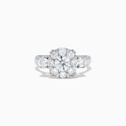 The Bouquet 14K White Gold Diamond Engagement Ring features a large round center diamond, a halo of sparkling stones, and diamonds along the band for added brilliance. Shown on a white background. Total carat weight: 1.91 TCW.