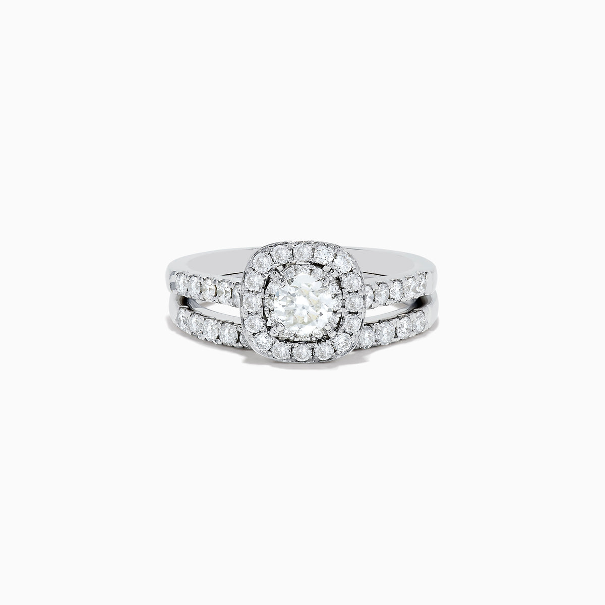 The Pave Classica 14K White Gold Diamond Engagement & Wedding Ring Set 1.34 TCW features a round center diamond, a sparkling diamond halo, and additional diamonds on the split band, shown against a white background.