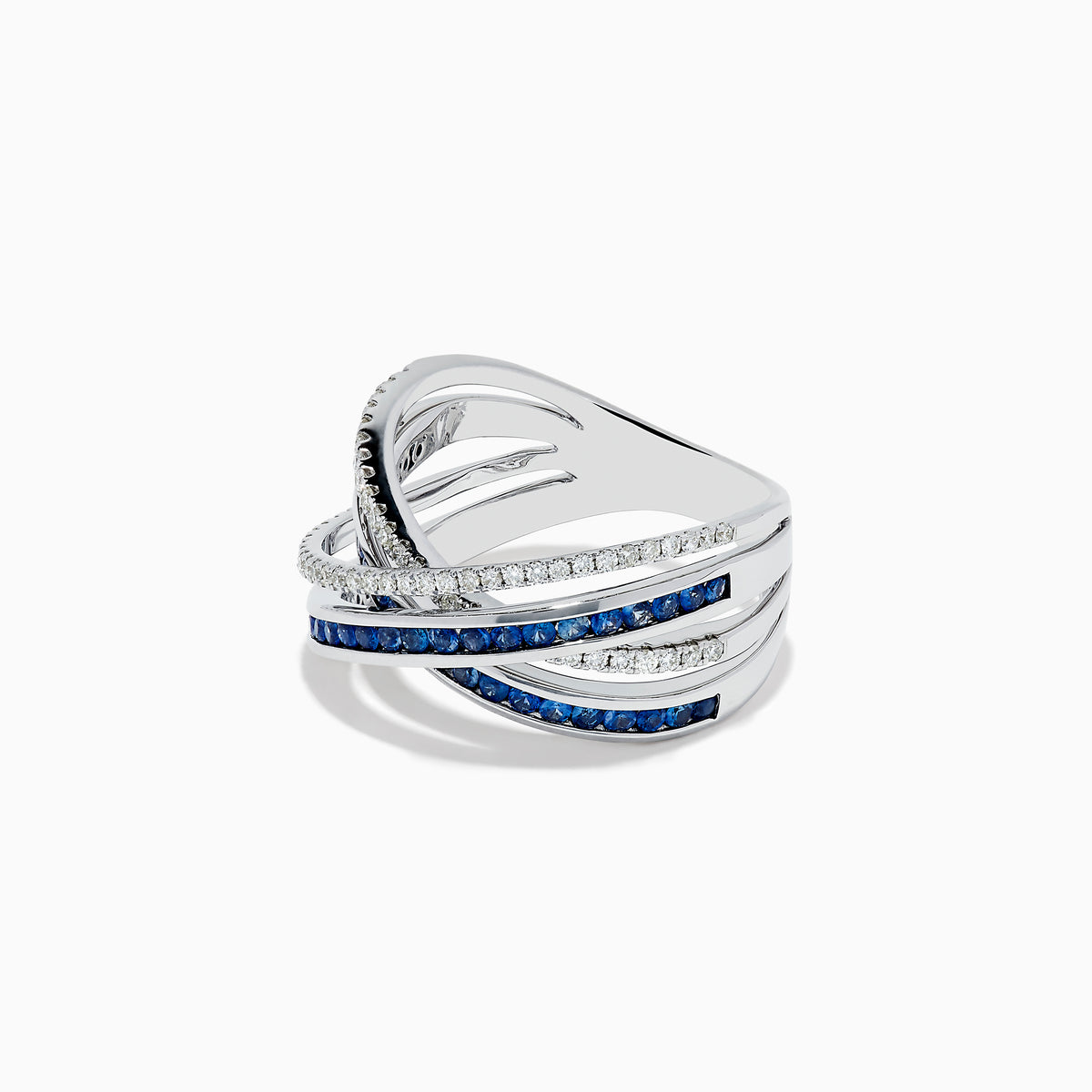 The 14K White Gold Blue Sapphire and Diamond Crossover Ring features overlapping bands adorned with sparkling diamonds and vivid blue sapphires in an elegant crisscross design, shown on a white background.