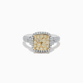 The Canare Two Tone Gold Cushion Shaped Cluster Yellow Diamond Ring 1.19 TCW features a vibrant yellow diamond cluster at the center, framed by white diamonds and accented with more diamonds along the band.