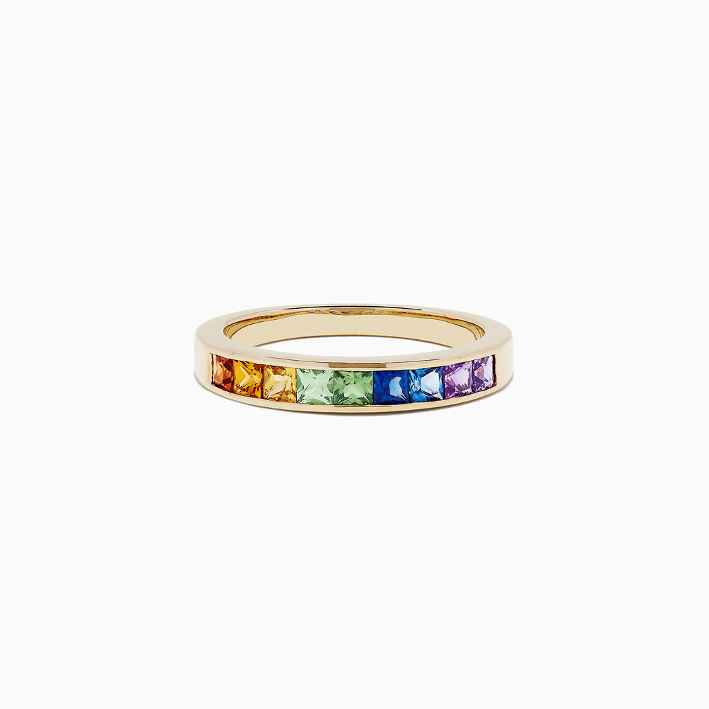 The Watercolors 14K Yellow Gold Channel Set Multi Sapphire Ring features square-cut rainbow sapphires, totaling 0.86 TCW, arranged side by side in a vibrant band.