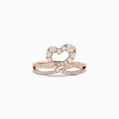 The Pave Rose 14K Gold Diamond Heart Ring, 0.66 TCW, is crafted in 14K rose gold with a heart-shaped design featuring an infinity symbol encrusted with sparkling diamonds, shown on a white background.