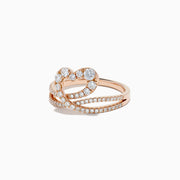 The Pave Rose 14K Gold Diamond Heart Ring, 0.66 TCW, is crafted in 14K rose gold with a heart-shaped design featuring an infinity symbol encrusted with sparkling diamonds, shown on a white background.