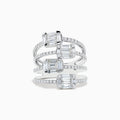 A Classique 14K White Gold Split Band Diamond Statement Ring with four emerald-cut clear stones and pavé diamonds forms stacked bands with intricate, sparkling details, showcased against a white background.