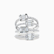 A Classique 14K White Gold Split Band Diamond Statement Ring with four emerald-cut clear stones and pavé diamonds forms stacked bands with intricate, sparkling details, showcased against a white background.
