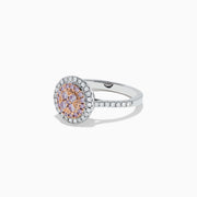 The 14K Two Tone Gold Pink and White Diamond Ring, 0.57 TCW, features a central pink diamond cluster surrounded by double white diamond halos and diamond accents along the band.