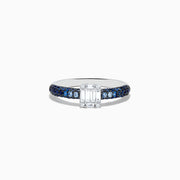 The Royale Bleu 14K White Gold Sapphire and Diamond Ring features a rectangular emerald-cut diamond centerpiece with round blue sapphires along the band, creating an elegant and symmetrical look. Shown photographed on a white background.