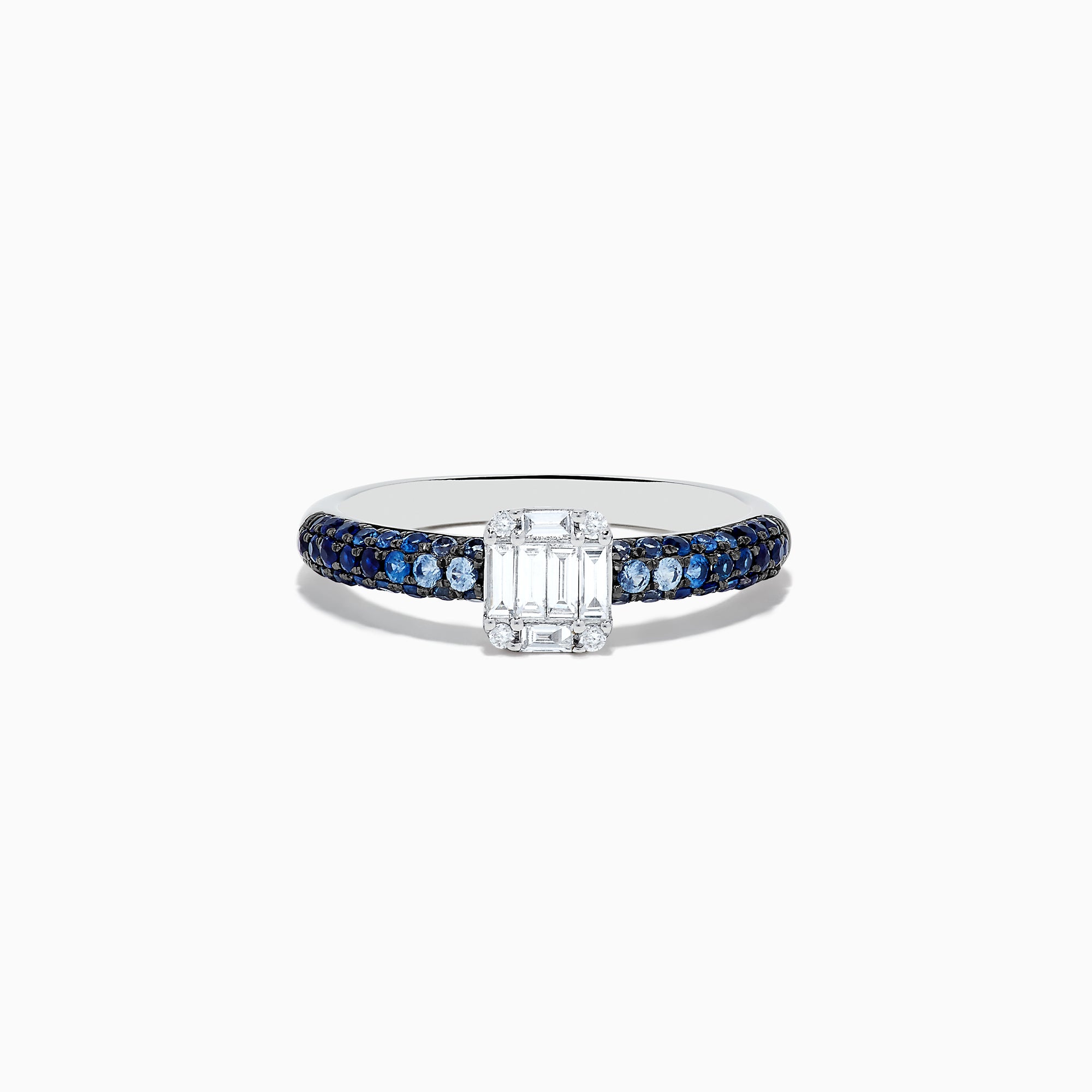 The Royale Bleu 14K White Gold Sapphire and Diamond Ring features a rectangular emerald-cut diamond centerpiece with round blue sapphires along the band, creating an elegant and symmetrical look. Shown photographed on a white background.