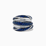 A 14K White Gold ring featuring overlapping bands with blue sapphires and white diamonds, evoking elegance and intricacy like the Royale Bleu 14K White Gold Sapphire and Diamond Ring, 1.04 TCW.