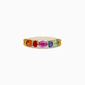The Watercolors 14K Yellow Gold Multi Sapphire Ring, 2.00 TCW, showcases a vibrant row of oval sapphires in rainbow hues—yellow, orange, red, pink, blue, and green—elegantly set side by side across the band.